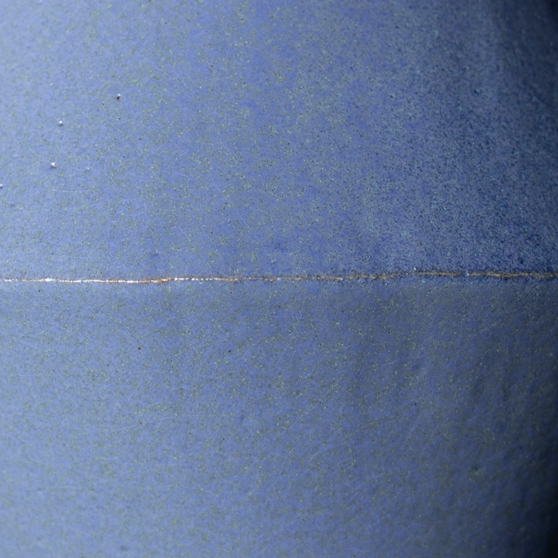 dark blue foggy glaze sample showing surface and light behavior